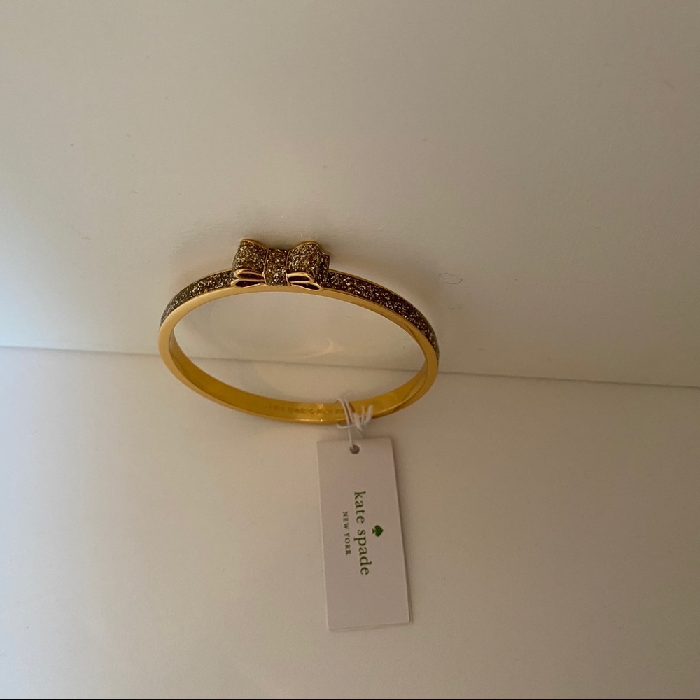 KATE SPADE NEW NWT BRACELET BANGLE GOLD PLATE GLITTER BOW MOON RIVER JEWELRY - Picture 6 of 8